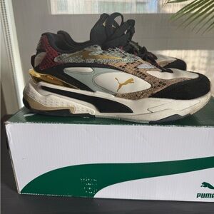 Puma Black and Gold Sneakers